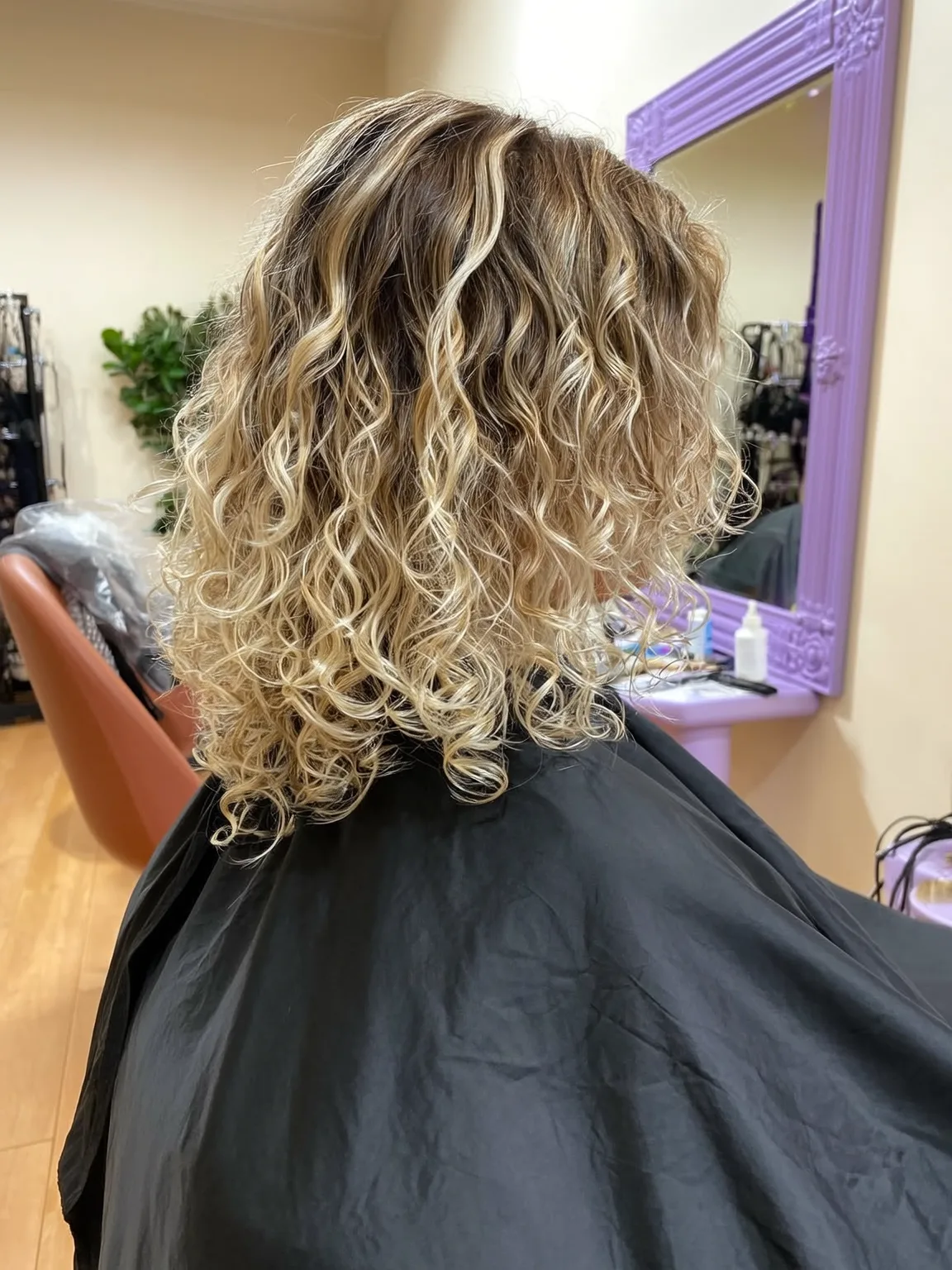 Golden Blonde Curly Layers with Dark Roots